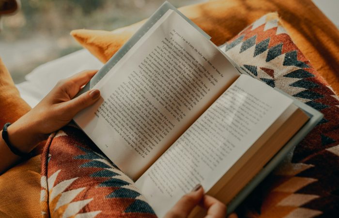 A person reads an open book